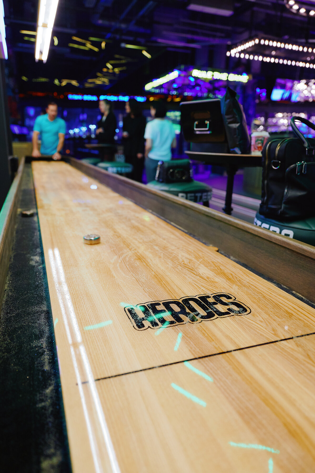 HEROES-branded shuffleboard table.