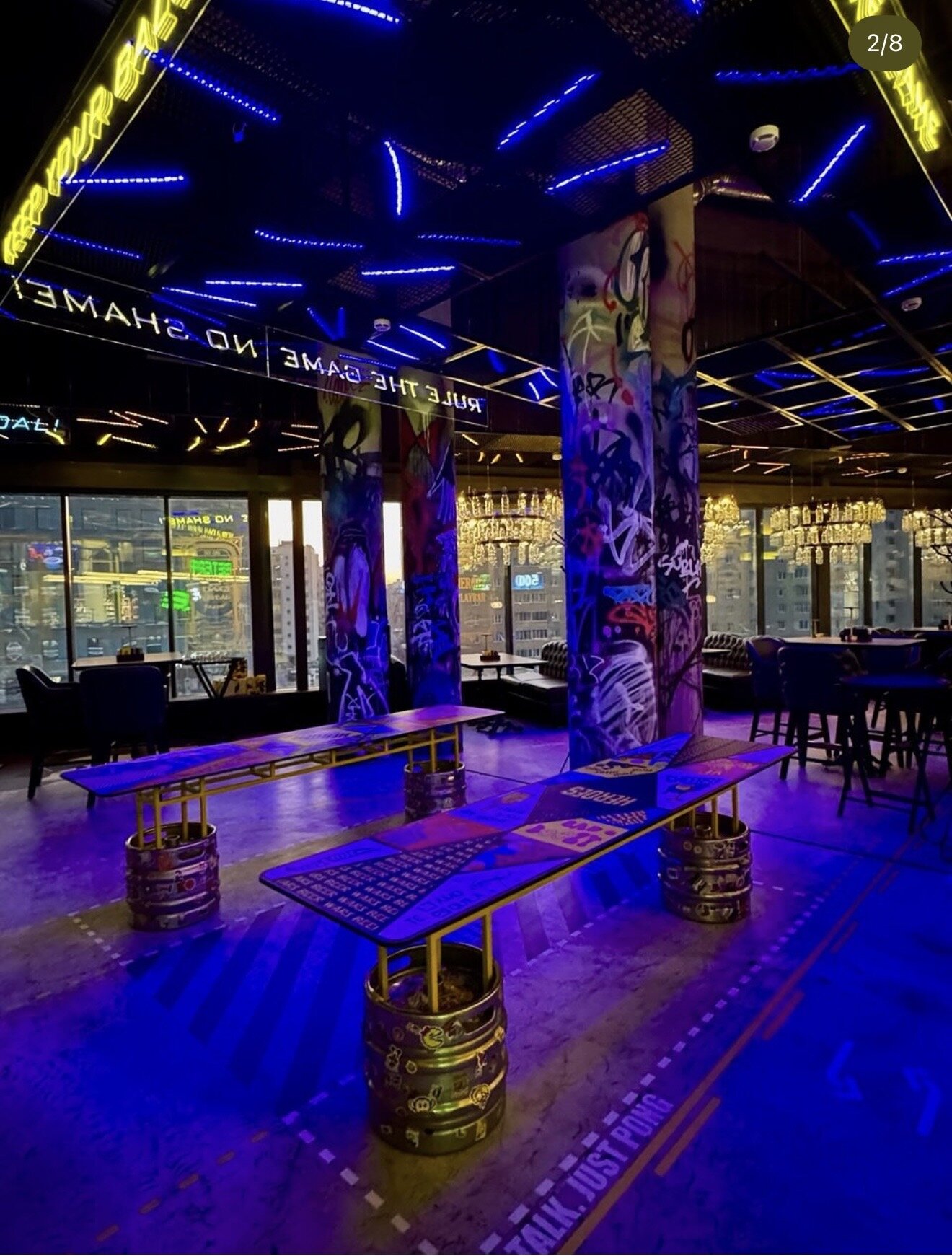 Beer pong tables and graffiti pillars.